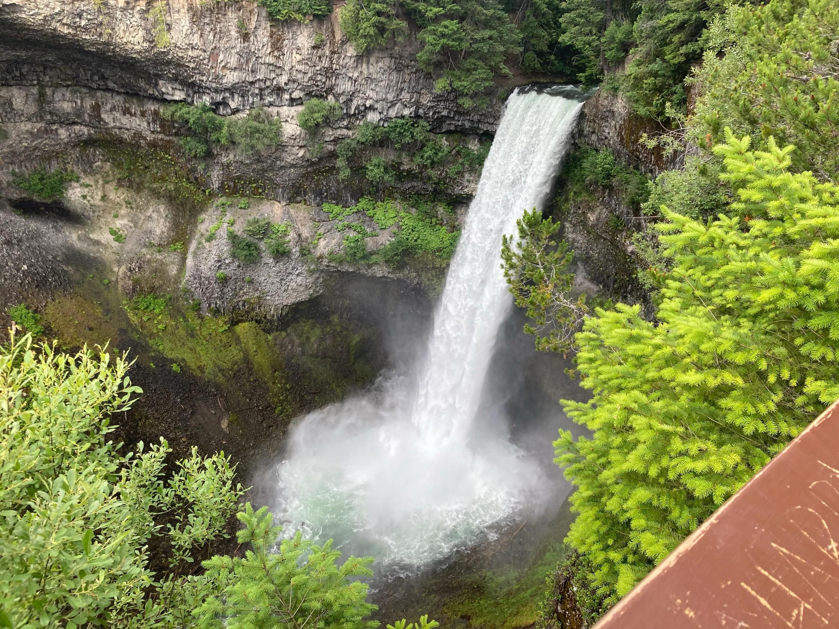 Brandywine Falls plunging into a misty pool, seen from above